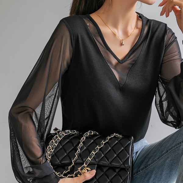 <B class="nakText">#NAKMADE.</b> Luxurious flowing, sexy mesh sleeve V neck tee